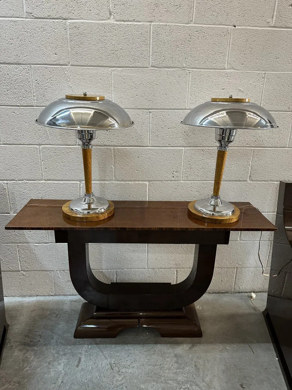 two antique table lamps with round bases and bright lights, illuminating the room