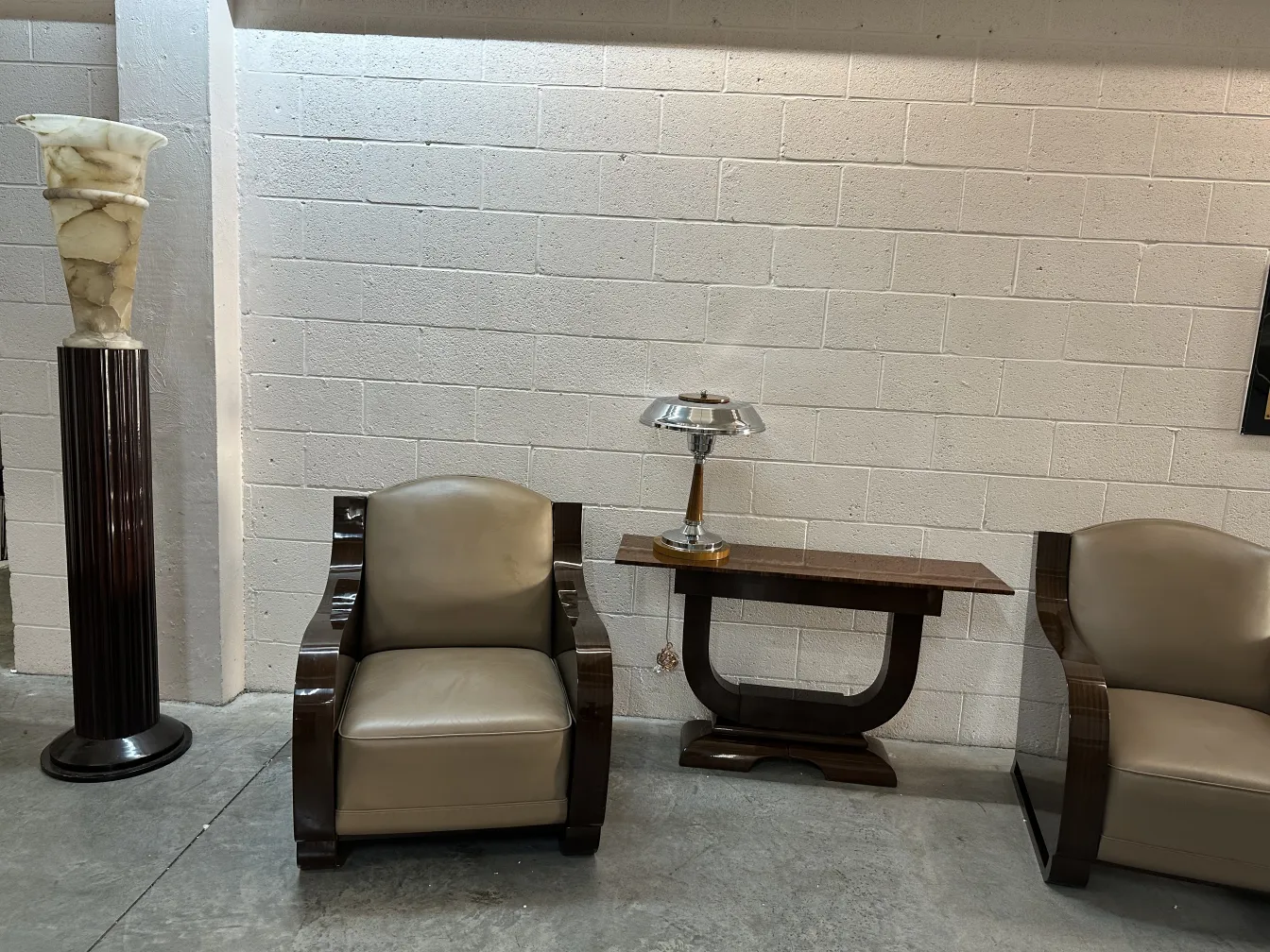 two antique table lamps next to chairs and a table