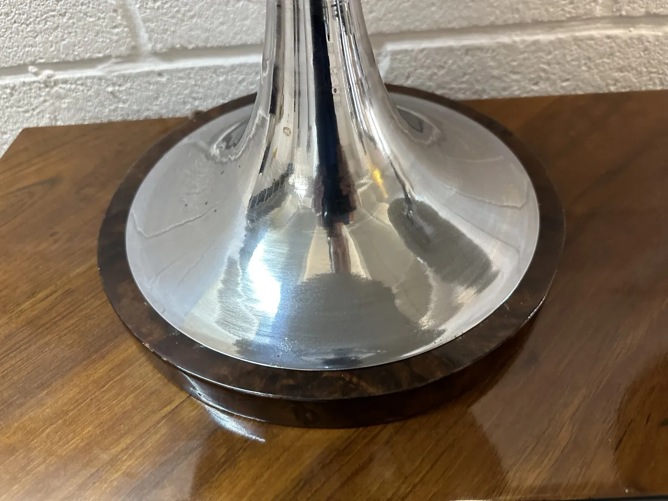 View of the shiny base of 2 antique table lamps