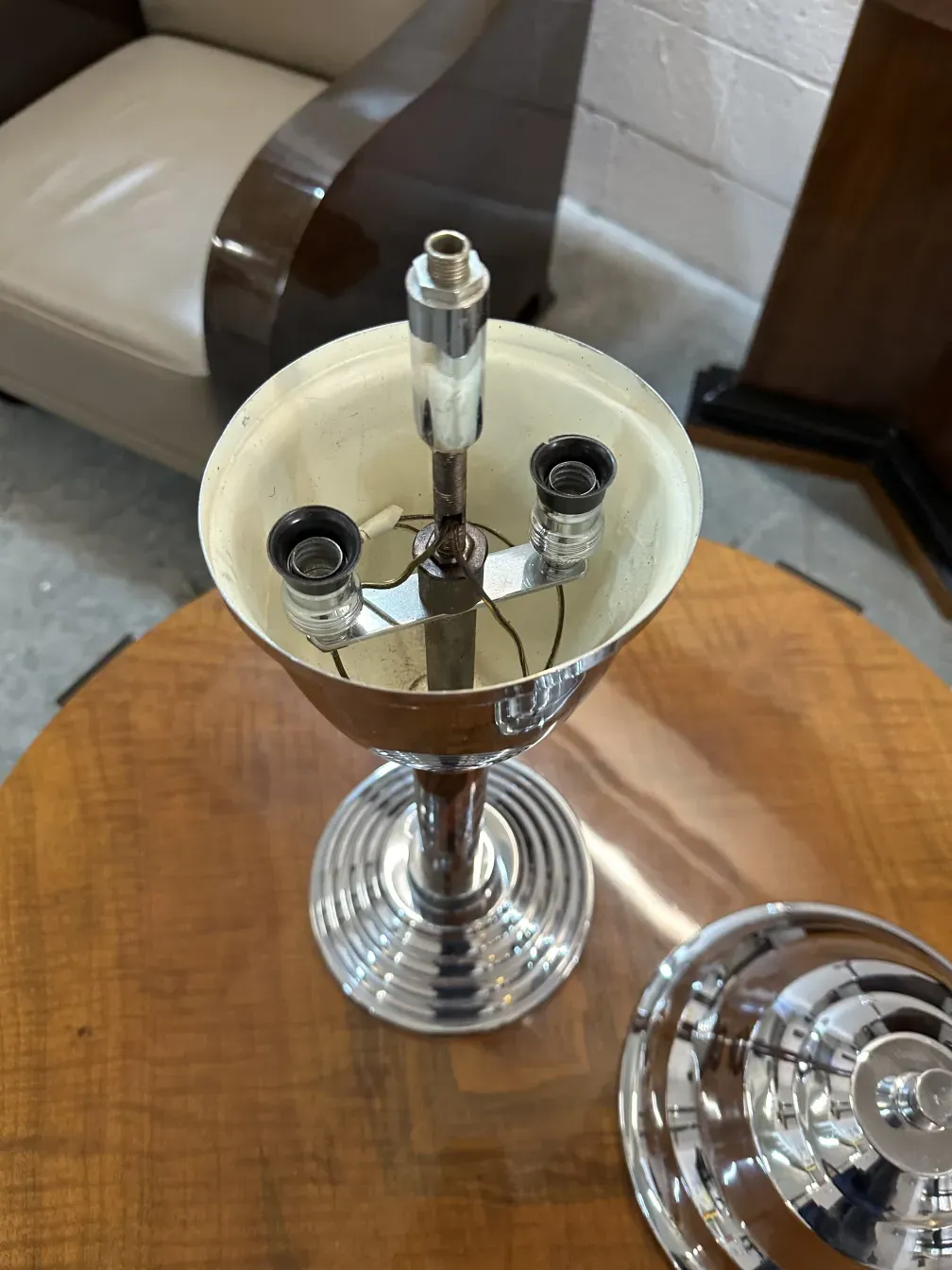 two antique table lamps in a decorative setting