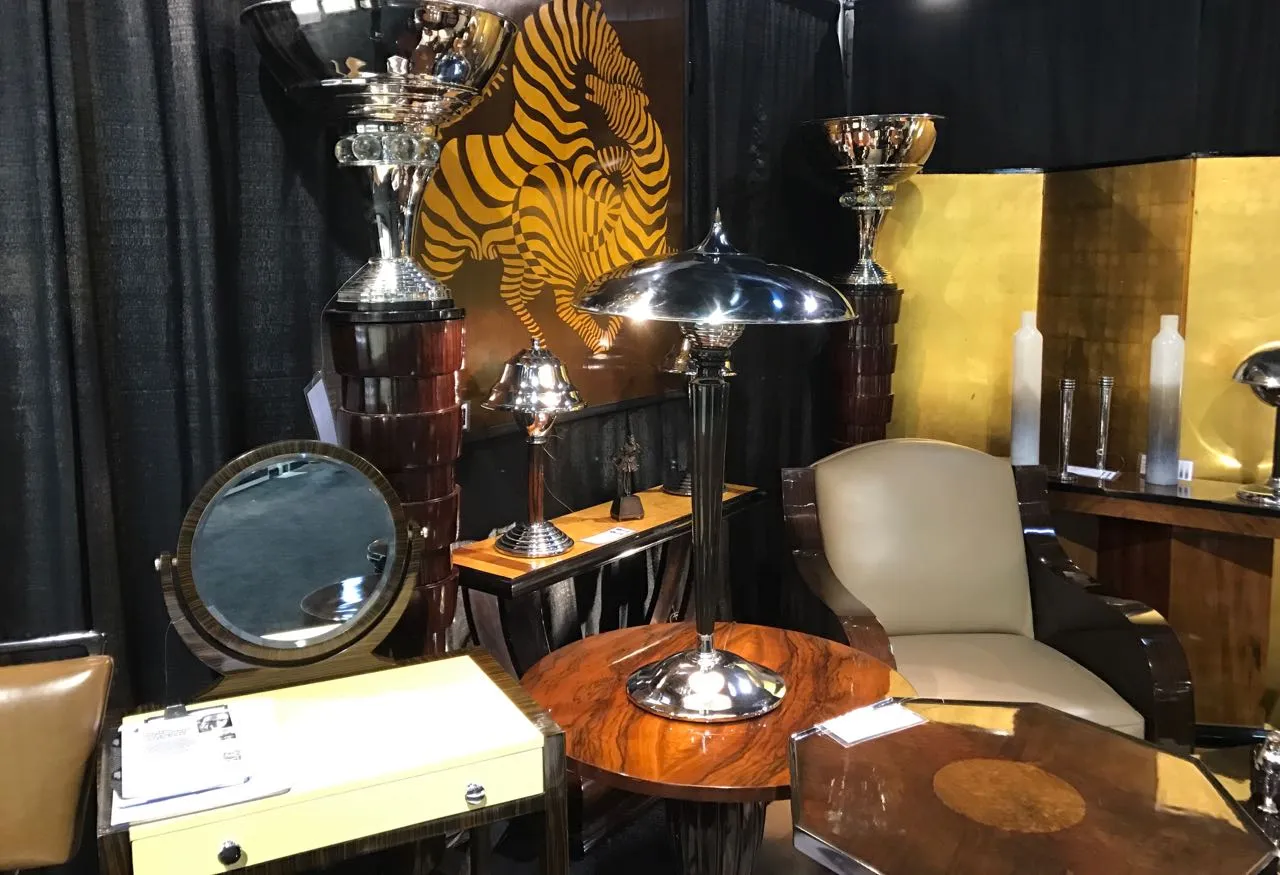 Two antique table lamps with elegant design on display.