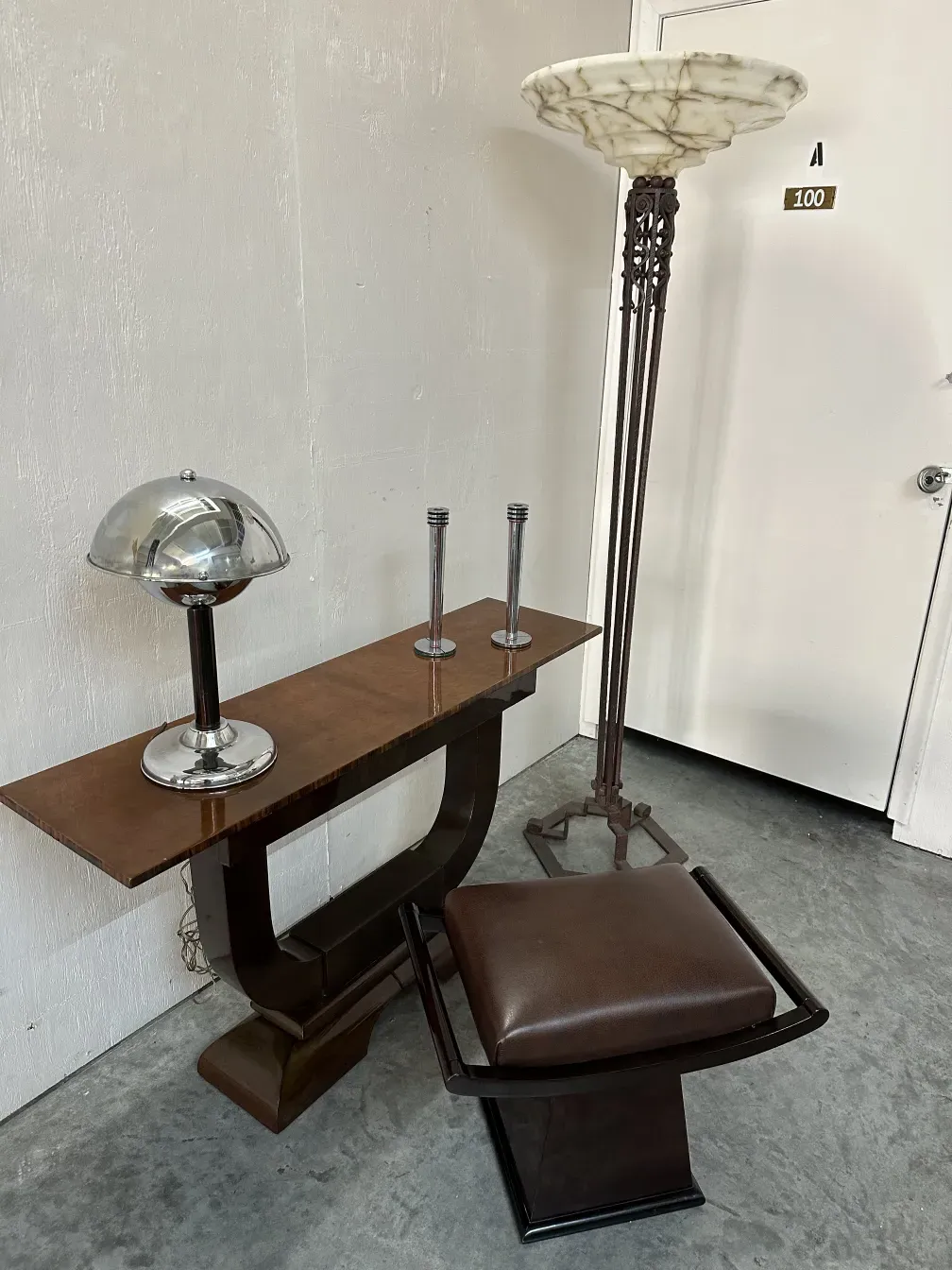 antique table lamp with decorative base in a neutral setting