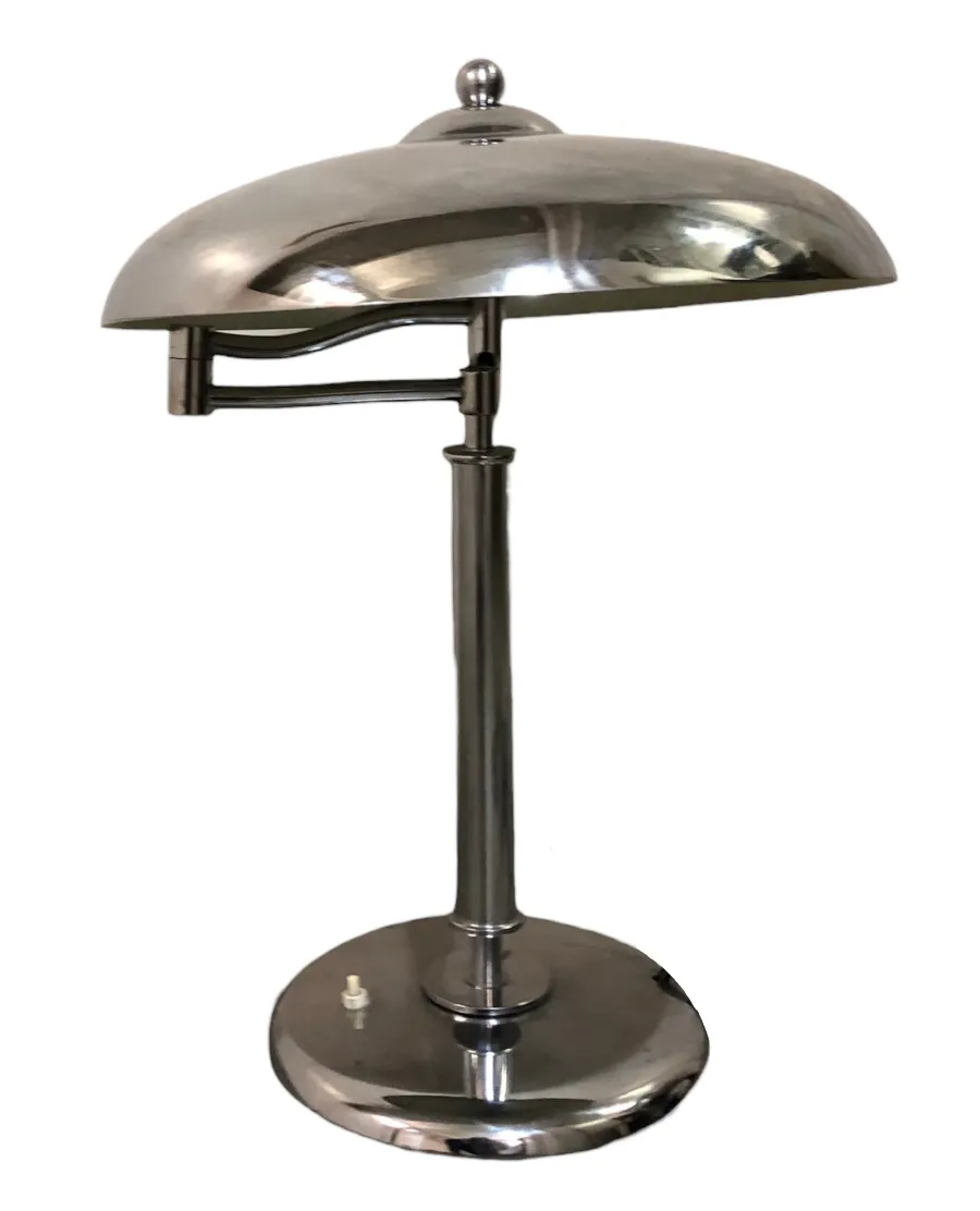 antique table lamp with an elegant design and a beautiful rounded shade, softly illuminating the surroundings
