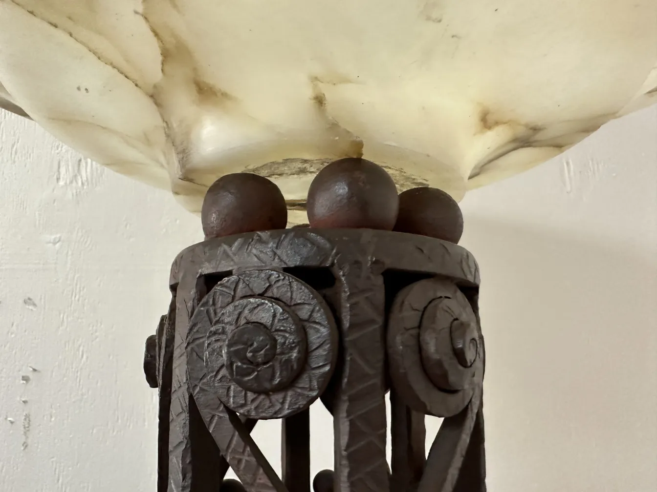 two antique floor lamps with decorative details