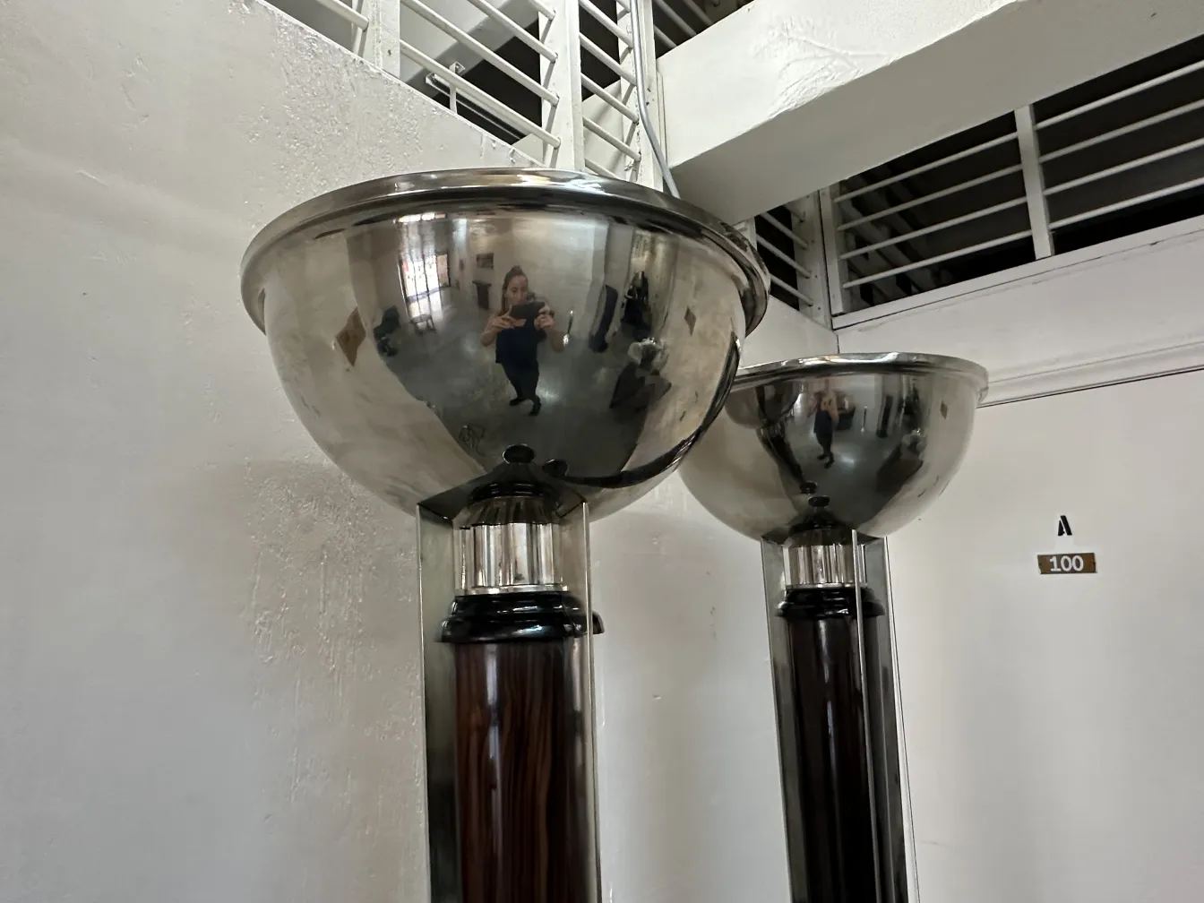 two antique floor lamps with round light shades