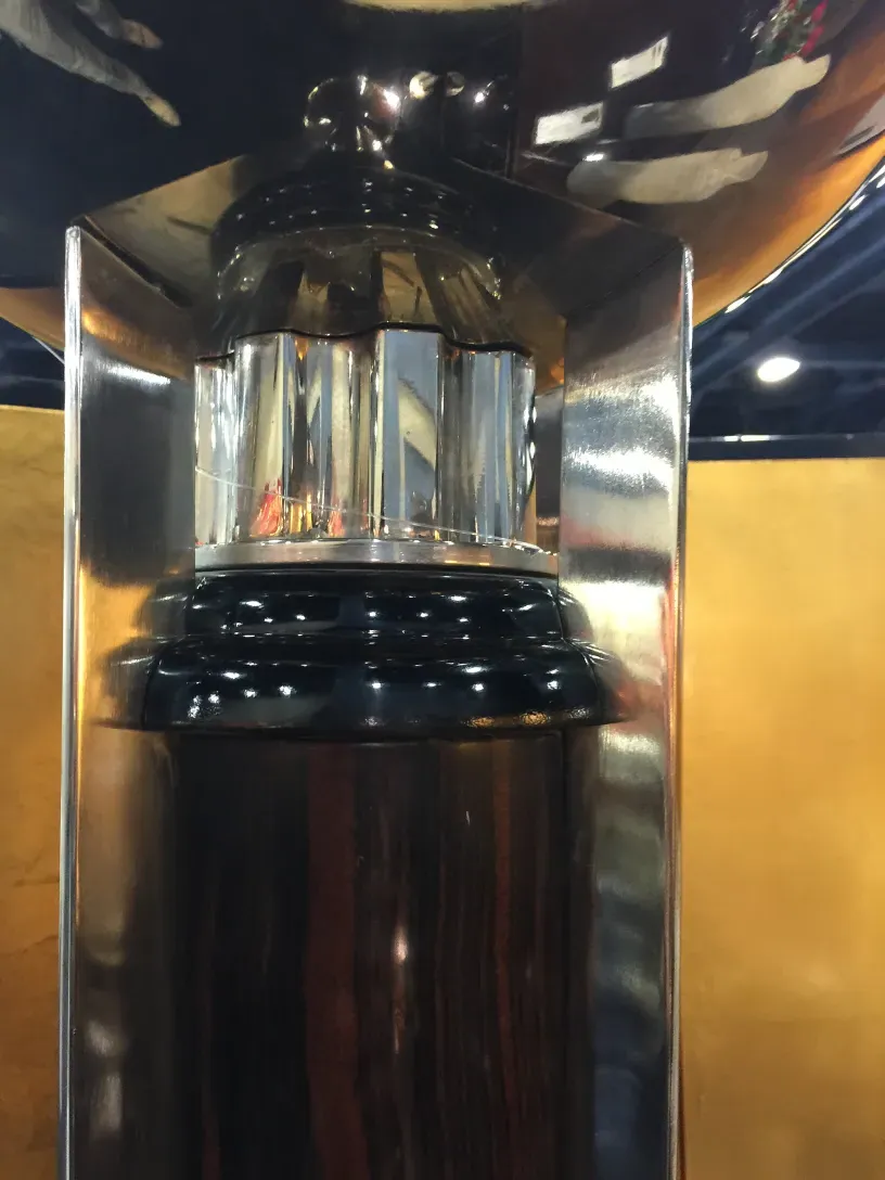 Close-up view of 2 antique floor lamps with design details