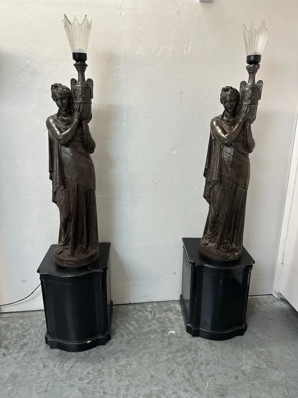 antique floor lamp with sculpted base and classic style