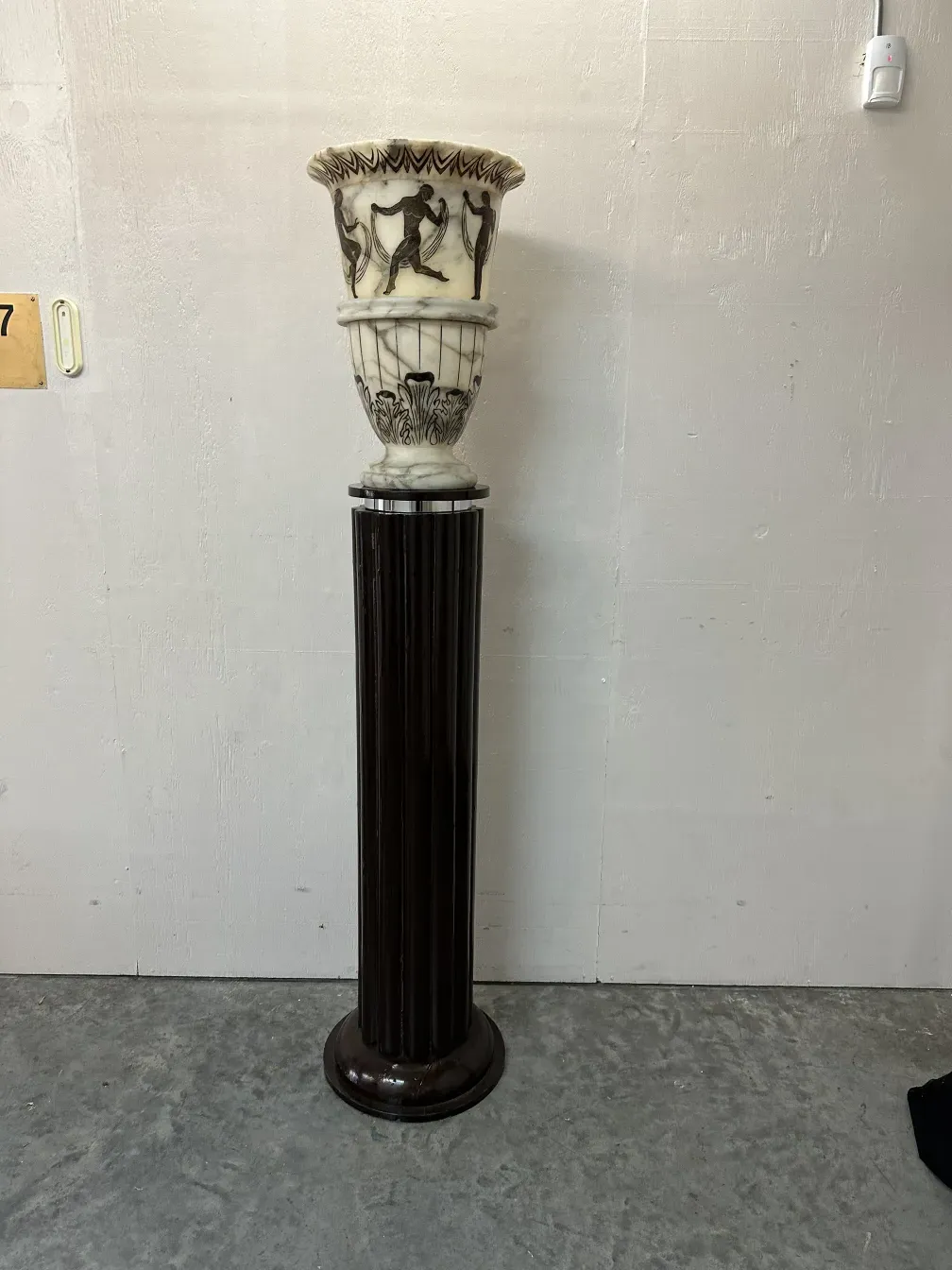 2 antique floor lamps with elegant design in neutral setting