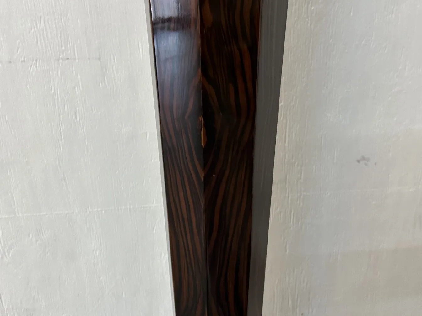 two antique floor lamps in a minimalist setting