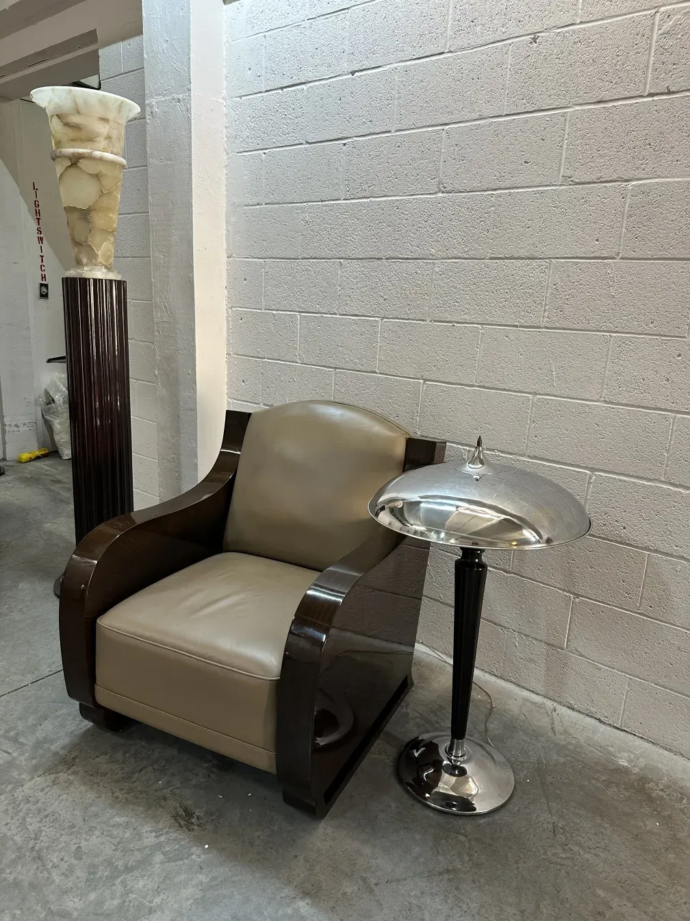 two floor lamps in an elegant setting with a sofa