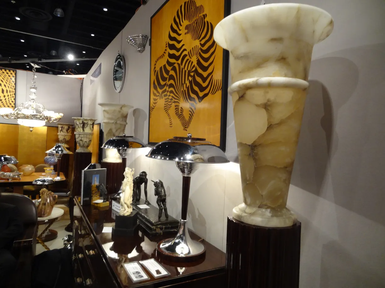 two antique floor lamps with elegant design in the background