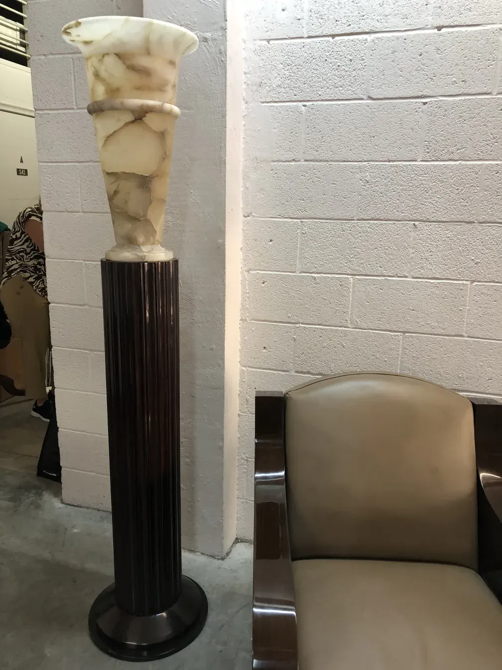 2 vintage floor lamps with decorative base in a modern setting