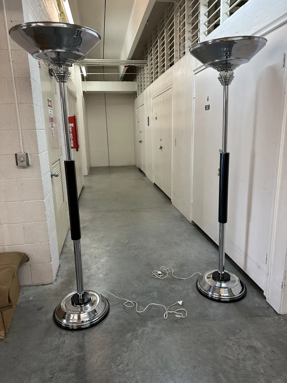 two antique floor lamps, elegant design, warm ambiance