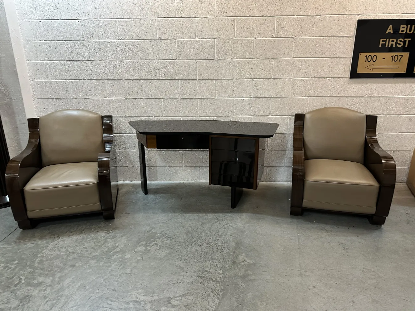 two vintage armchairs in good condition in a neutral setting