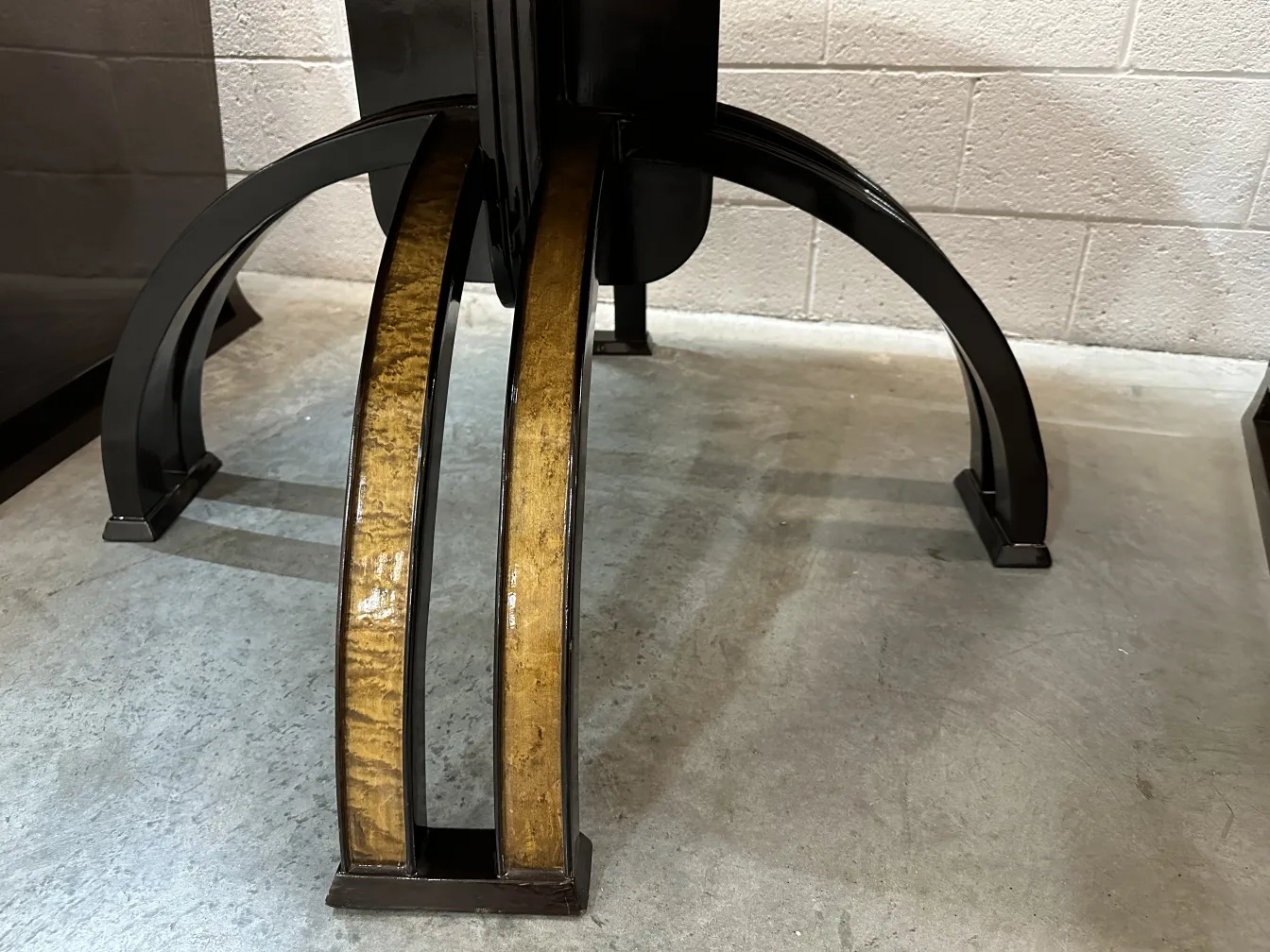 antique coffee table with curved base and light tones in the setting