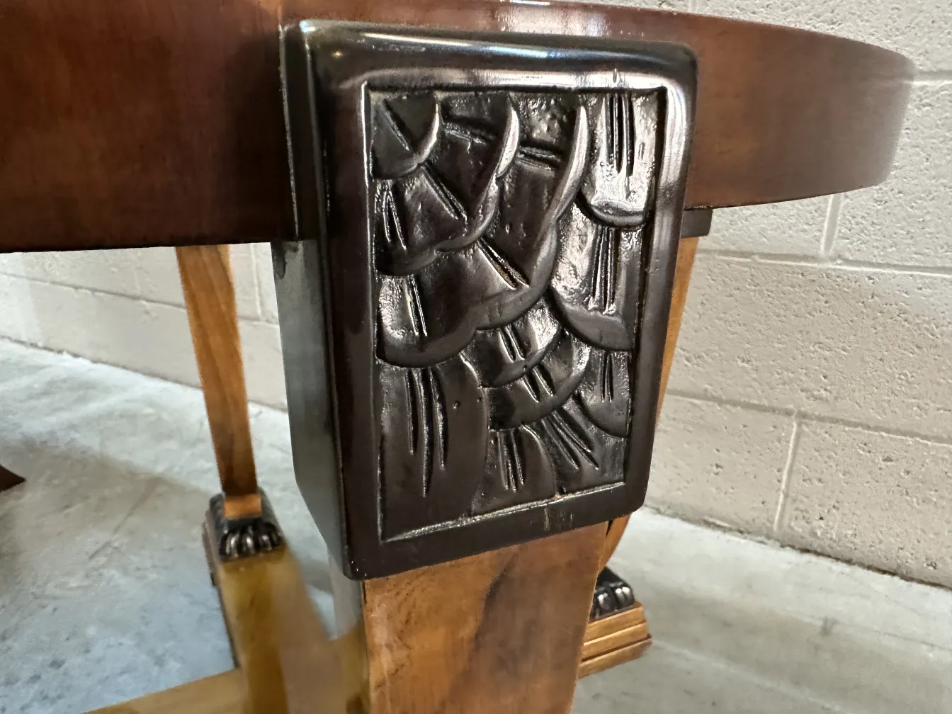 Antique coffee table with decorative details in an elegant setting.