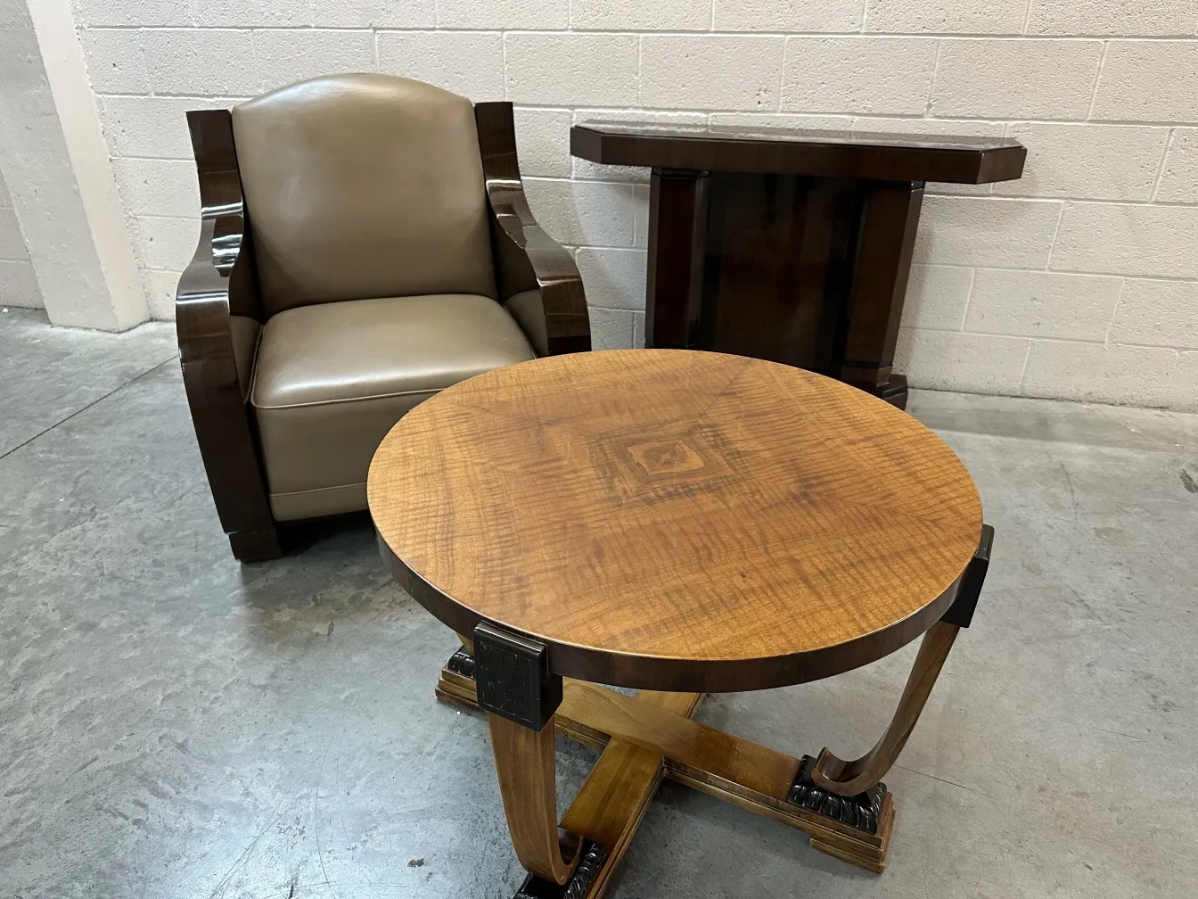 round antique coffee table with decorative details in a cozy setting
