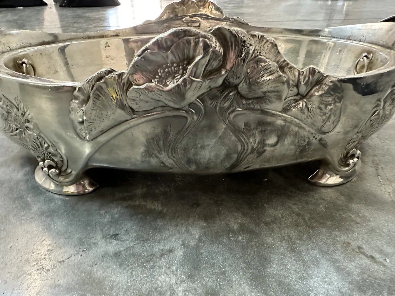 antique centerpiece by Gallia, featuring floral engravings and elegant curves.