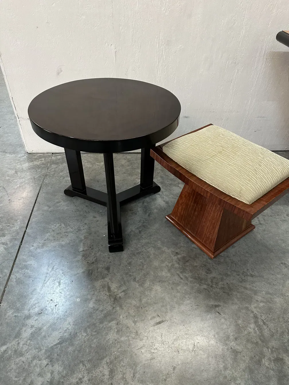 antique stool with cream upholstery in a modern setting
