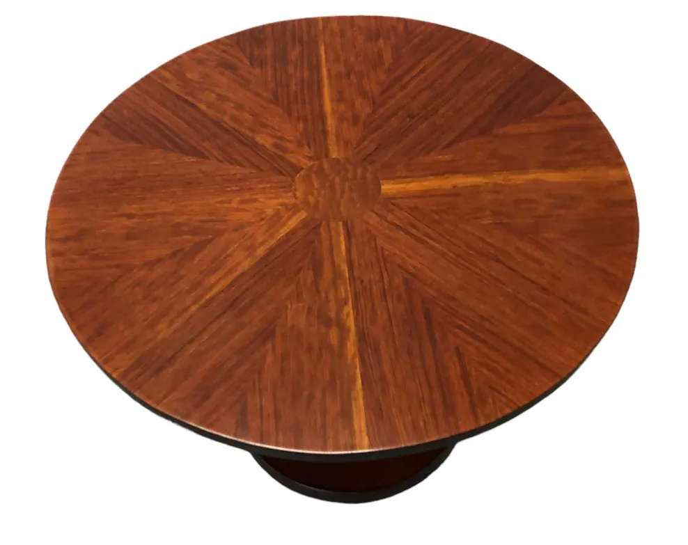Antique round table with design on the surface, perfect for decorative accents.