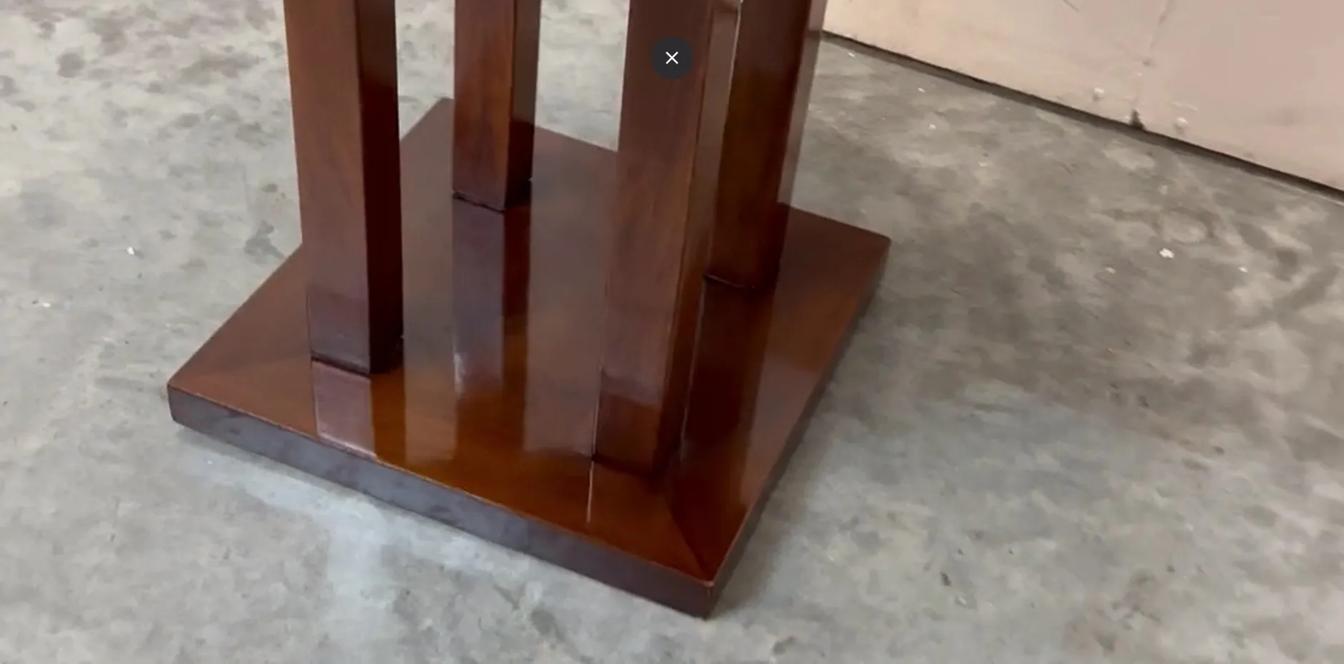 antique small table with straight legs in a calm setting