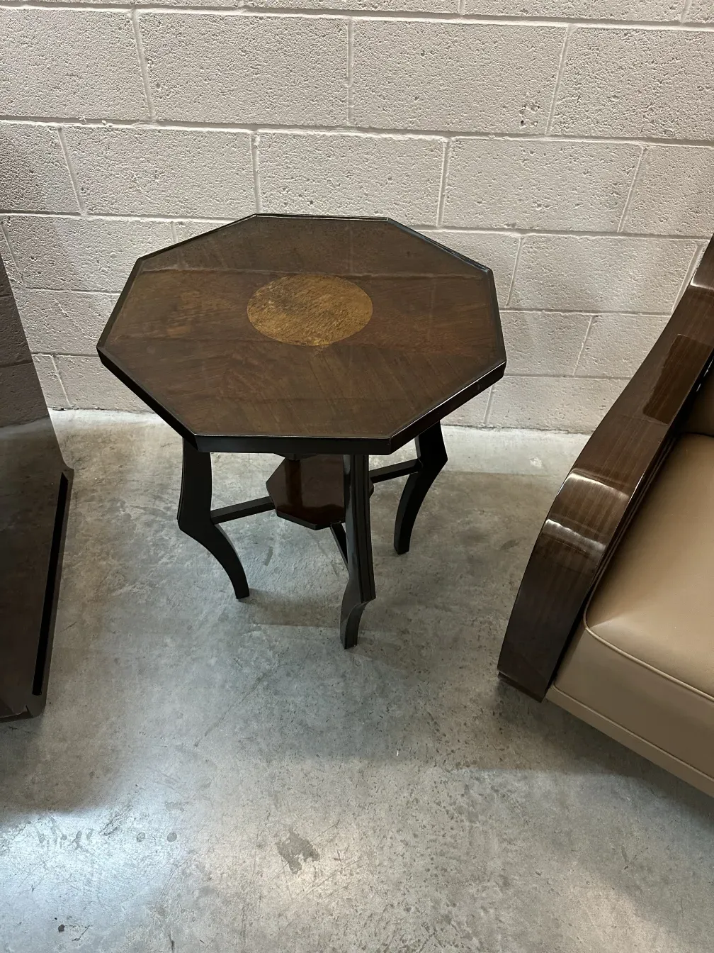 Antique octagonal small table with unique design.