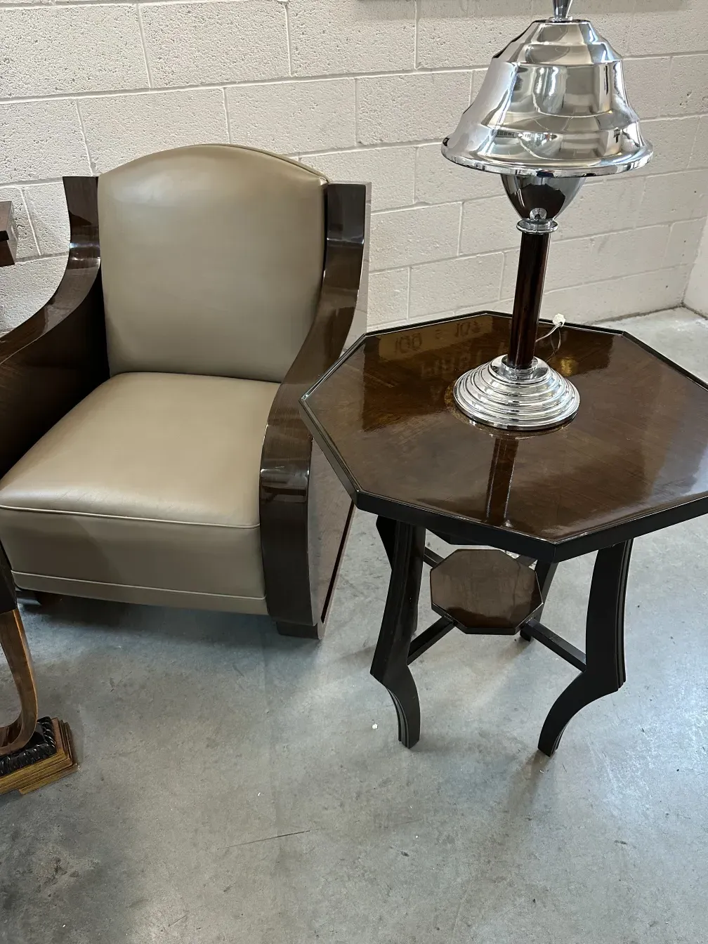 antique small table with lamp in simple setting