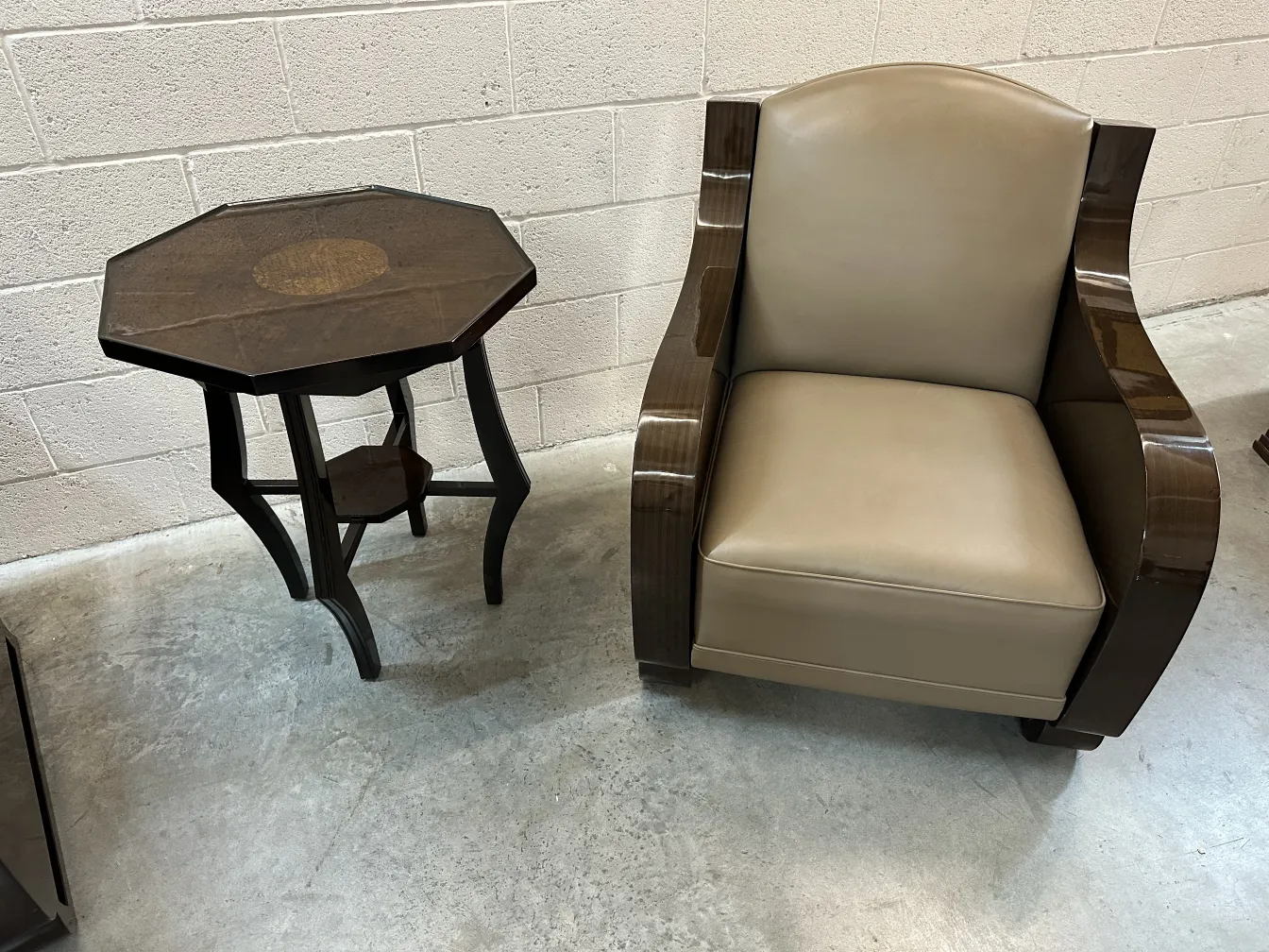 antique octagonal small table next to an armchair