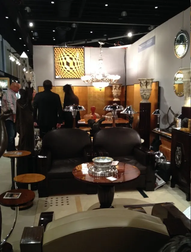 Antique small table with a round shape, surrounded by elegant decor.