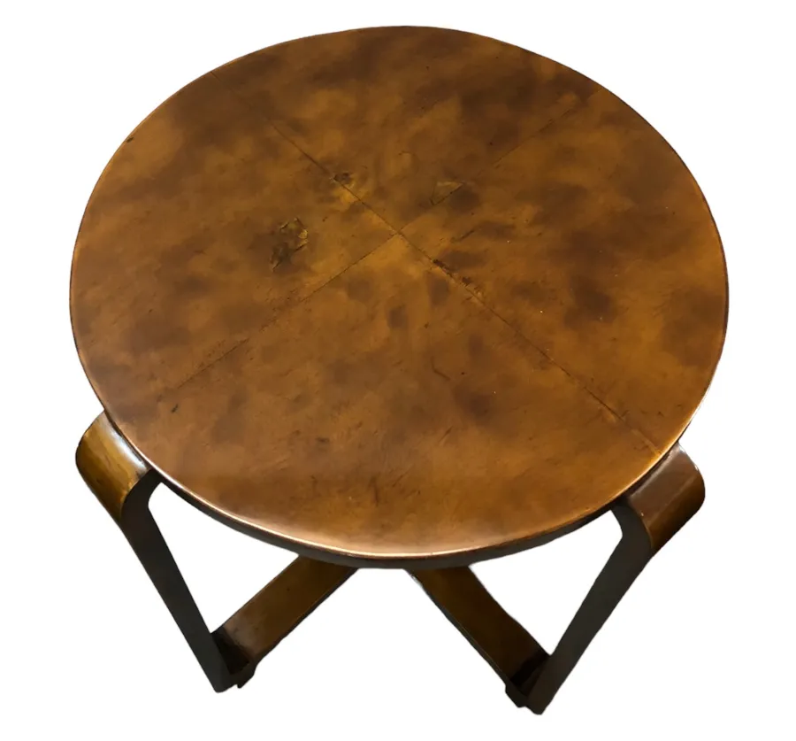 antique round small table with crossed legs, cozy setting