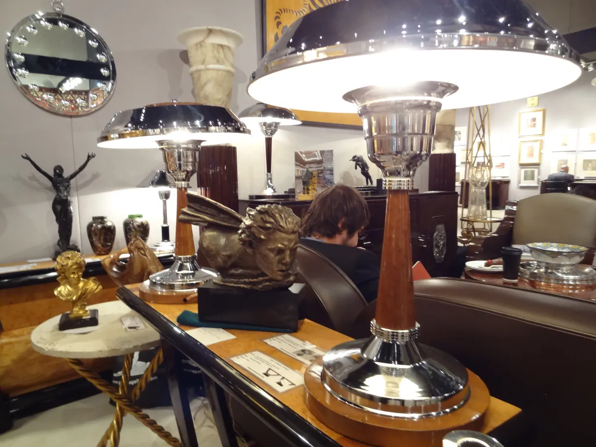 Two antique tables with decorative details in an elegant setting