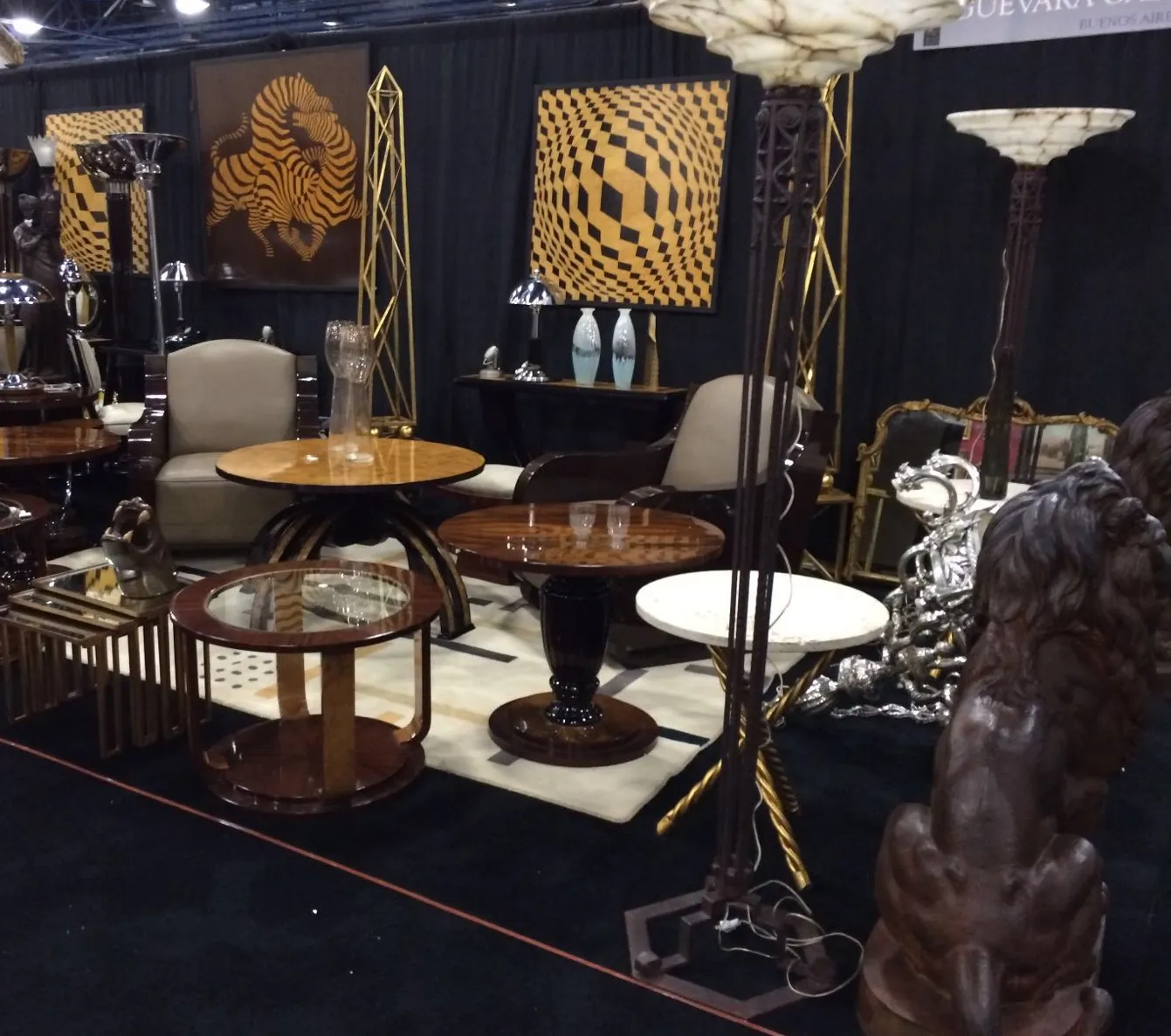 two antique small tables in an elegant environment with lamps