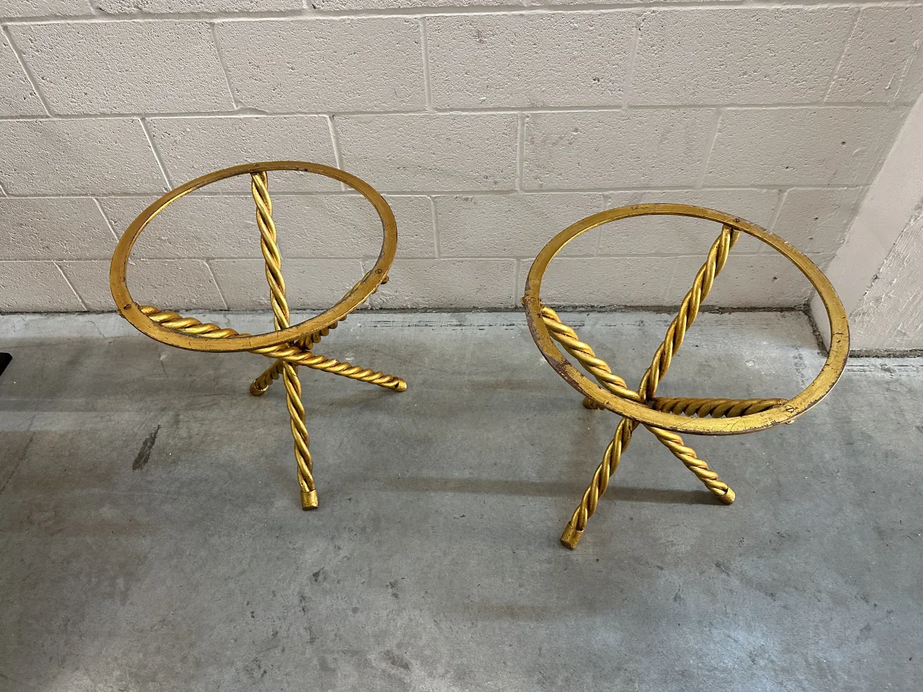 2 antique small tables with intertwined legs and circular design