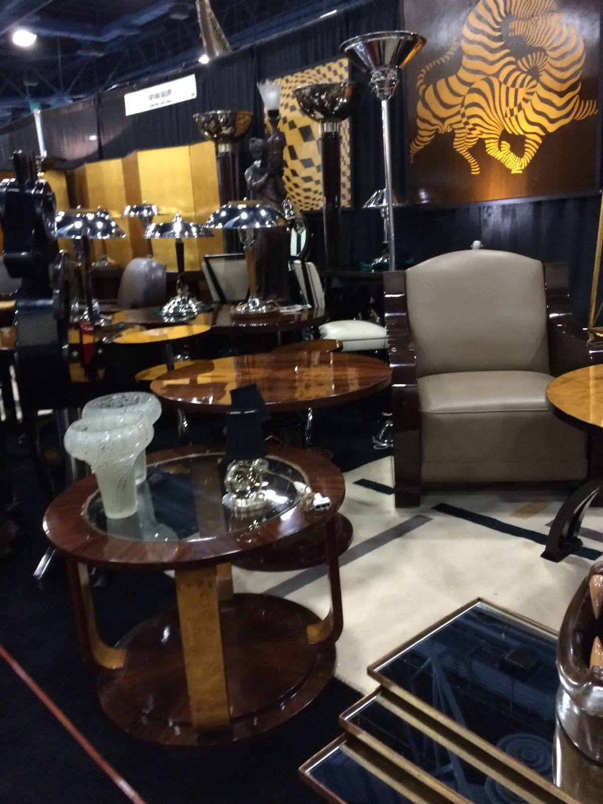 2 antique small tables, decorated with circular bases and glass tops.