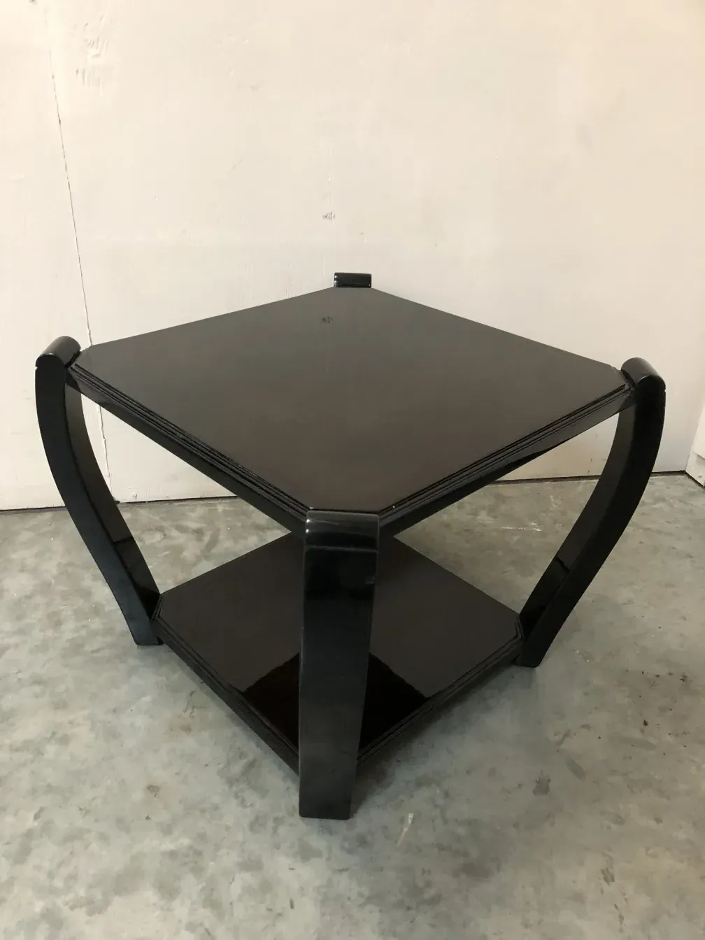 two antique small tables in dark color with elegant details