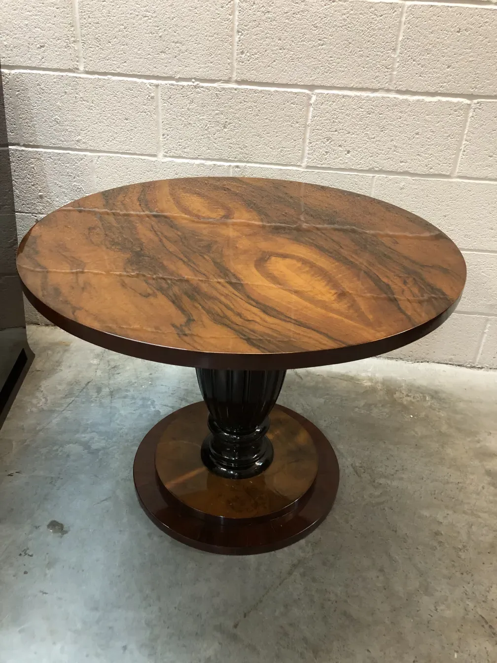 2 antique small tables, one with a black base and brown top