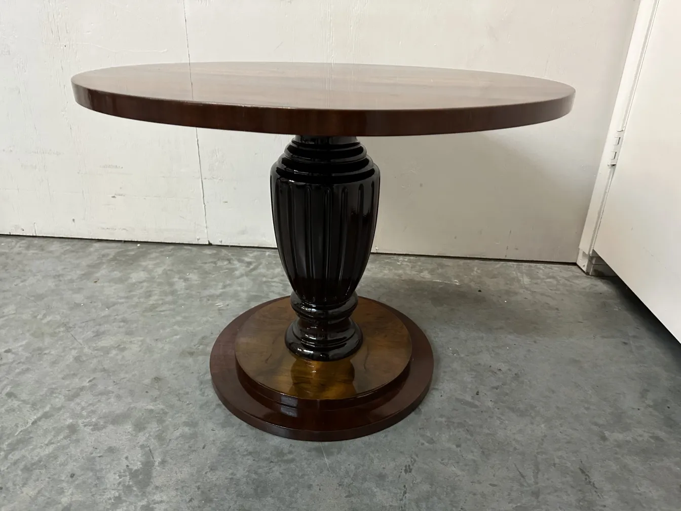 Two vintage small tables with classic design in a neutral setting