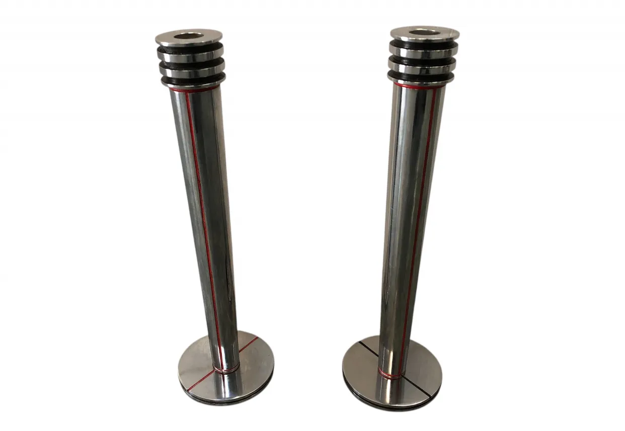 Antique candlesticks with distinctive features in a classic setting.