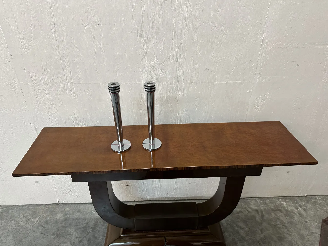 two antique candelabras on a stylish table