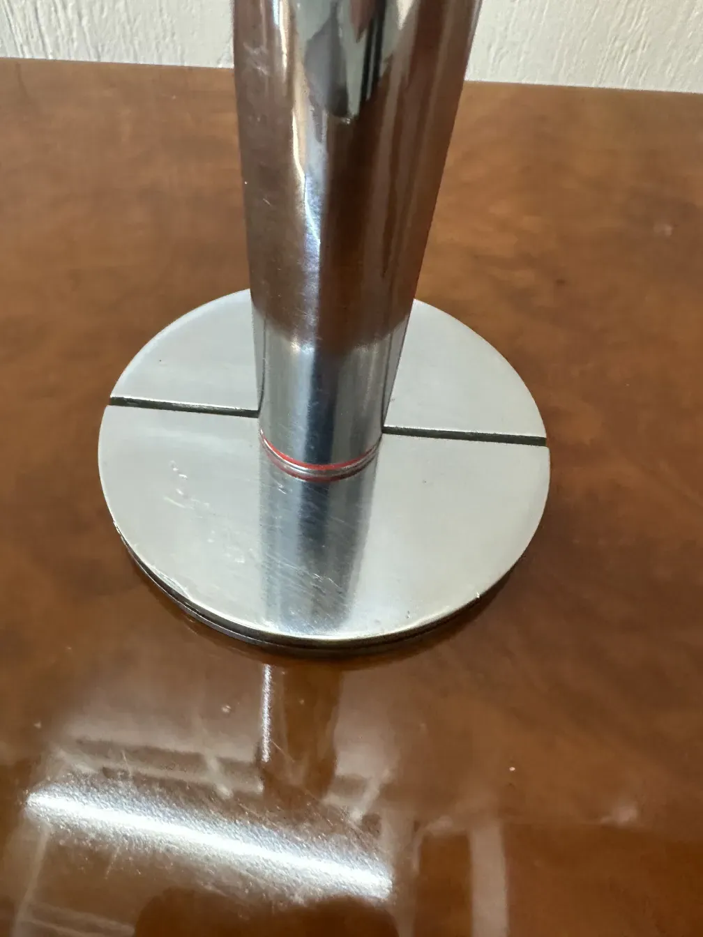 two antique candelabras with shiny round bases