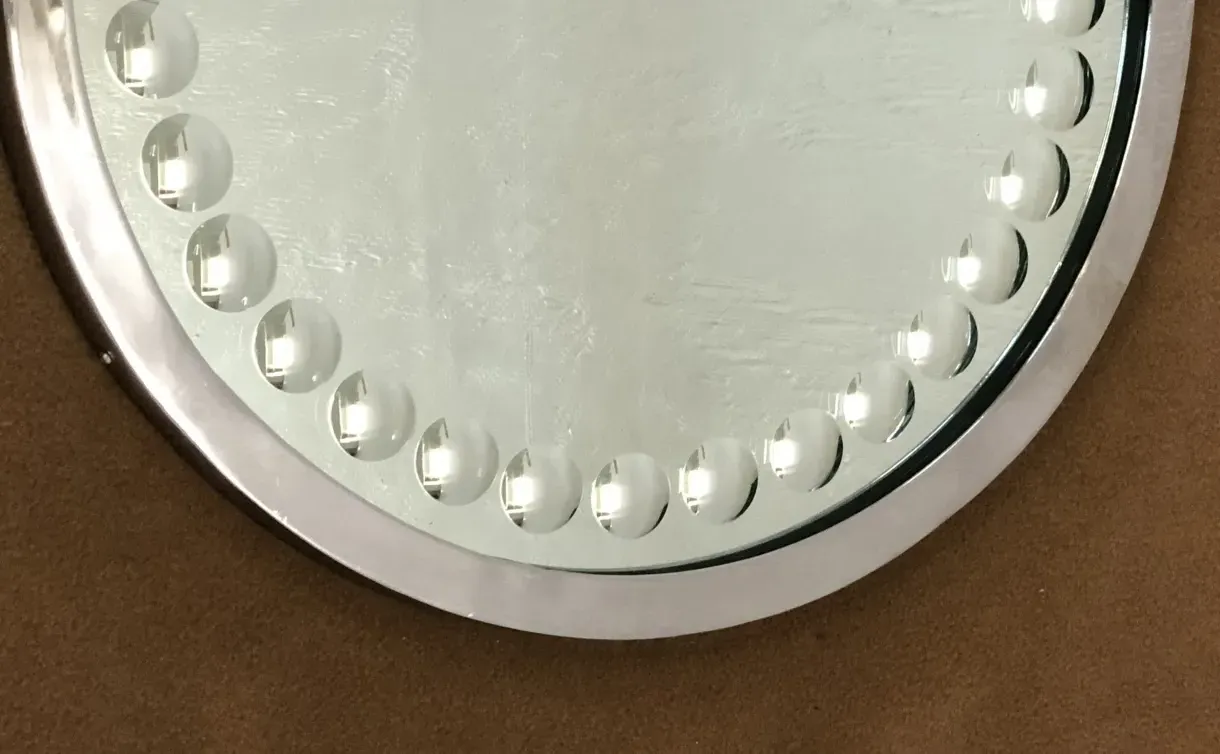 two antique mirrors with decorative edges