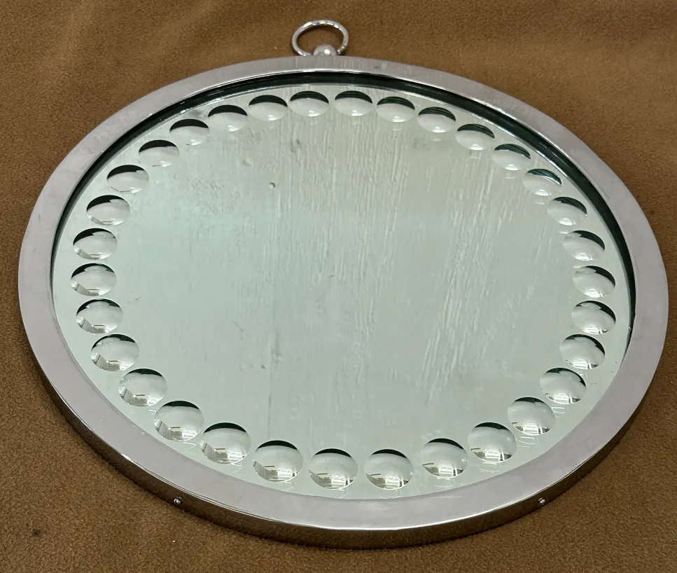 two round decorative mirrors with details