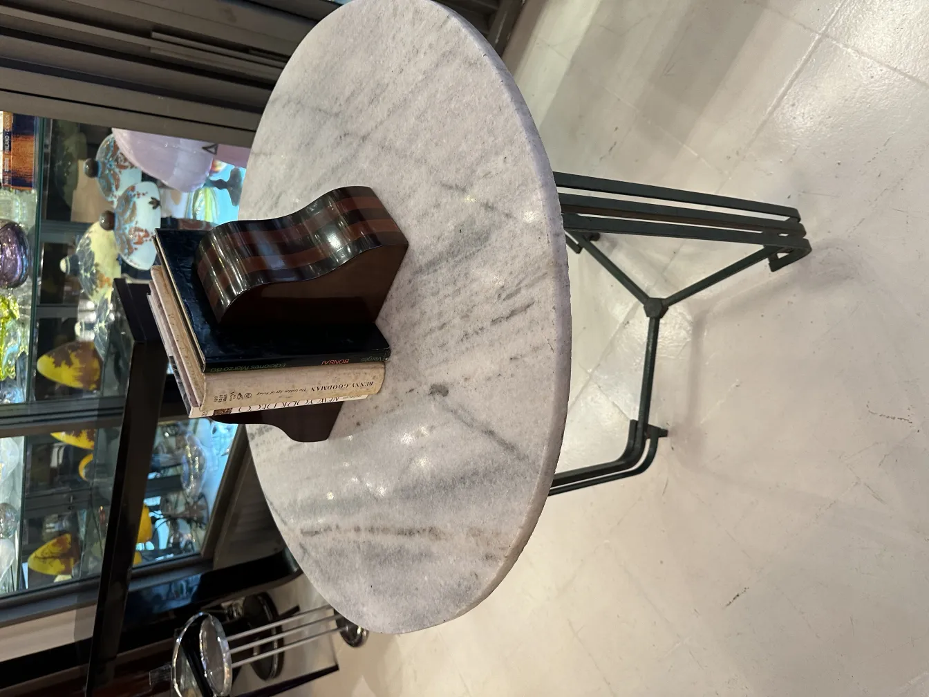 Vintage bookends shaped like guitars on a marble table