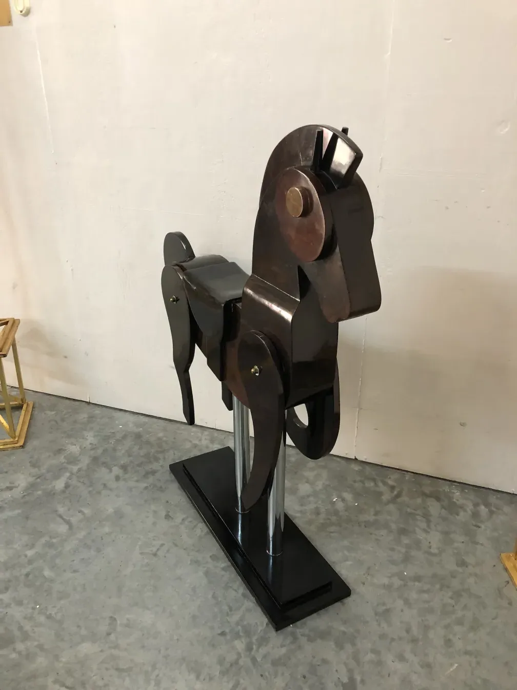 Antique sculpture of 2 horses on display, detailed view.