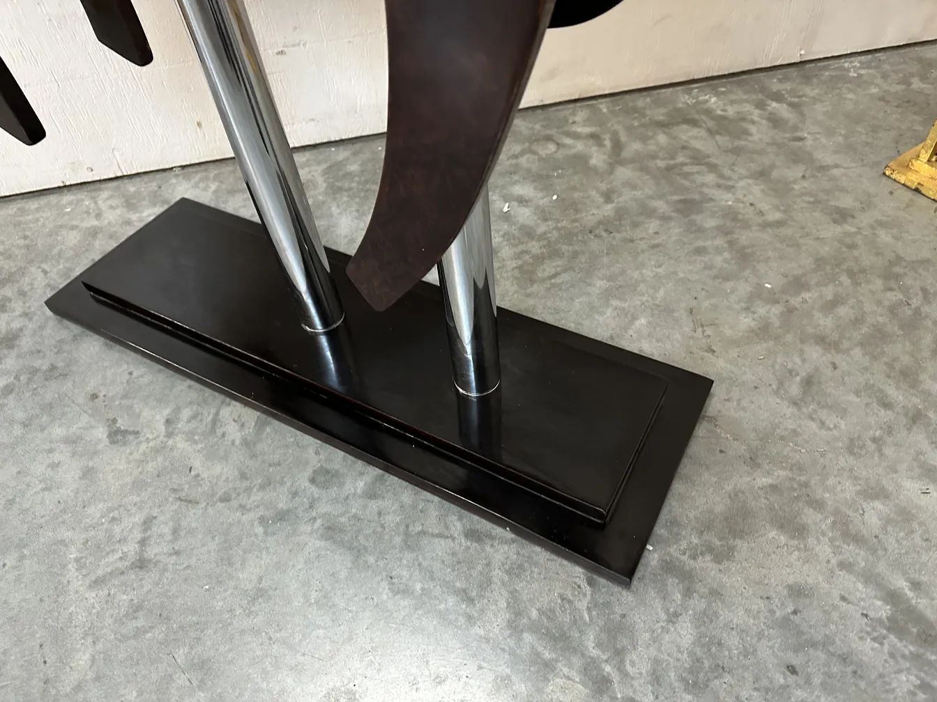 Antique horse sculpture on a modern stand.