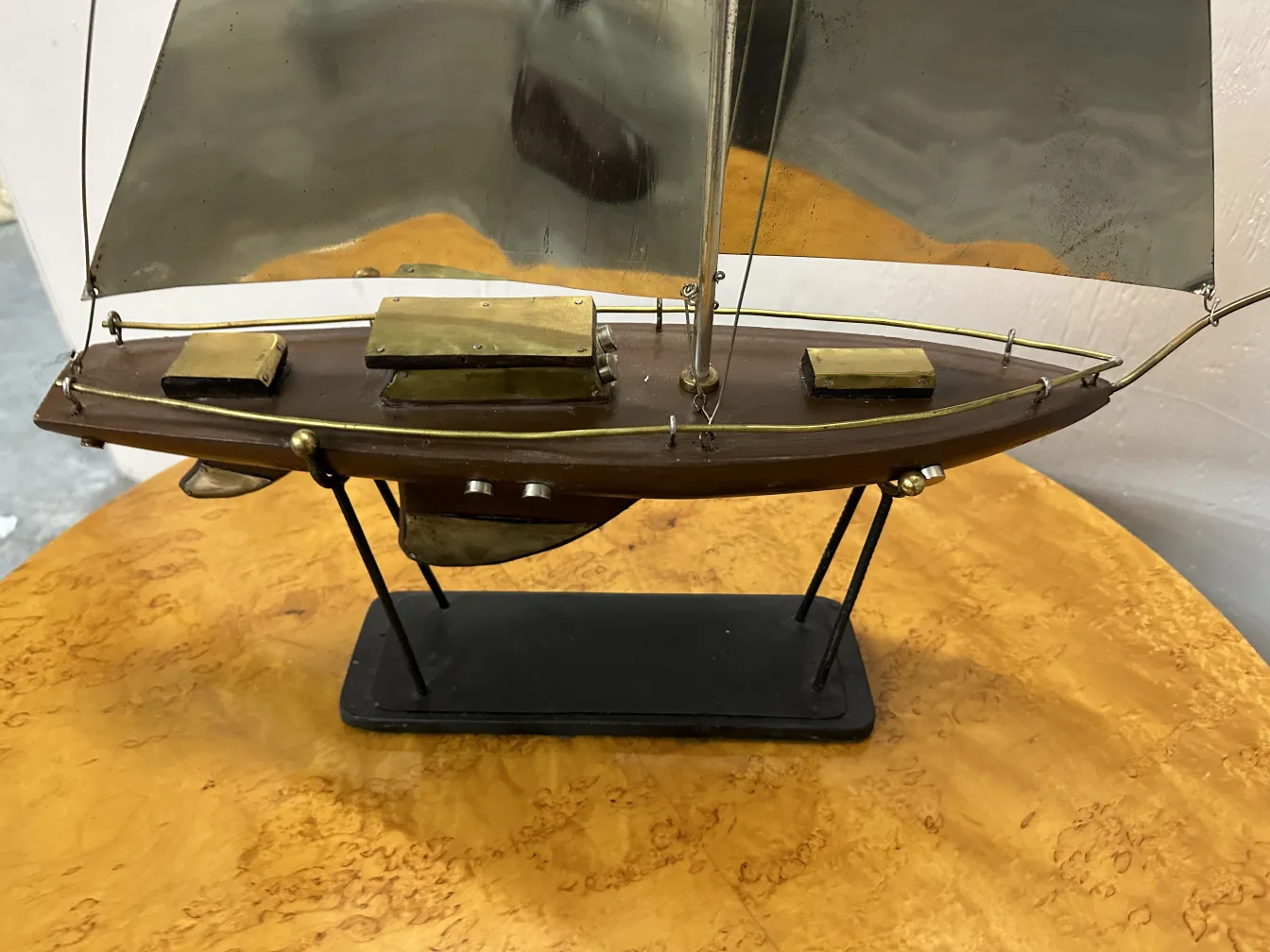 miniature of an antique designer's ship with silver sails