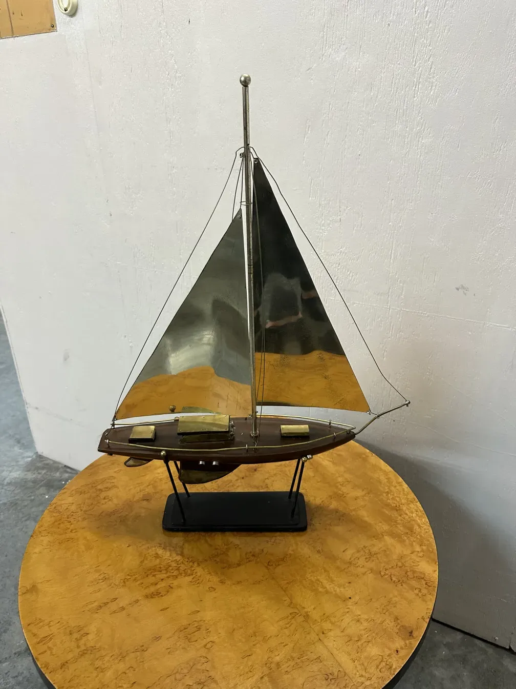 antique designer's ship model with shiny sails in a classy setting