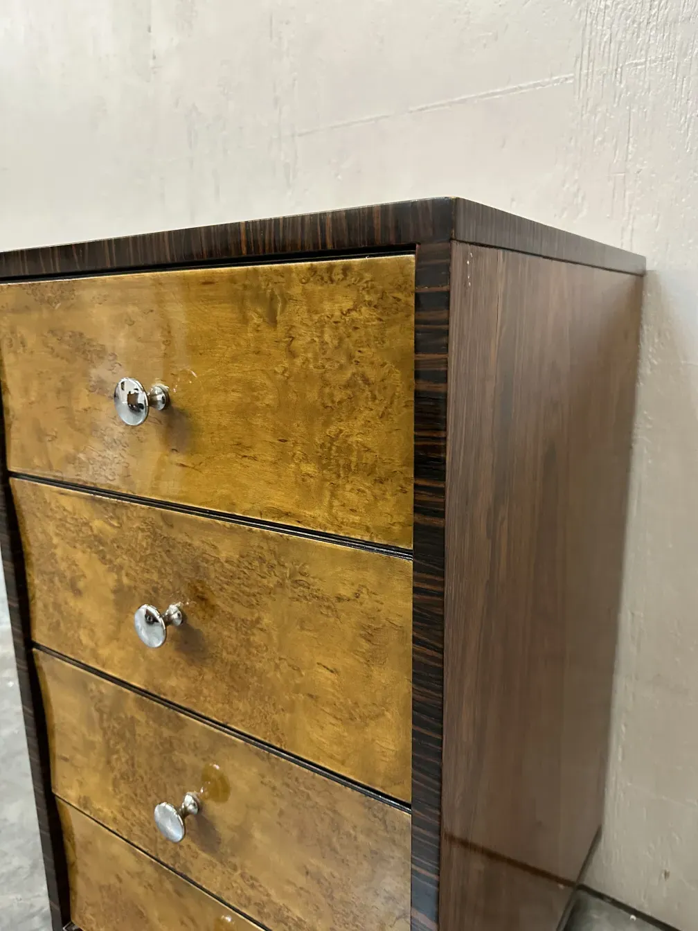antique cabinet with shiny finish and six drawers