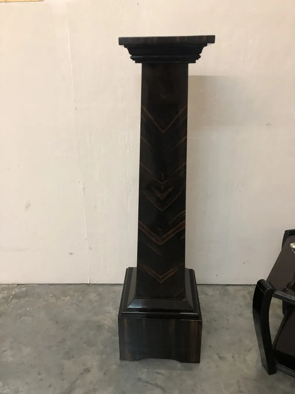 side view of an antique decorative column with elegant shape