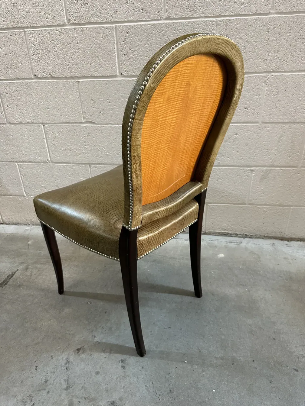 Side view of 12 antique chairs with elegant details